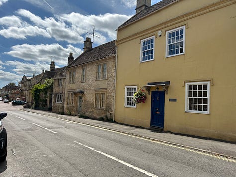 Two old cottages, numbers 75 and 77 High Street, Corsham, Wiltshire. Number 75 has the remains of the sign for the Temperance Hotel above a ground floor window. Images: Roland's Travels