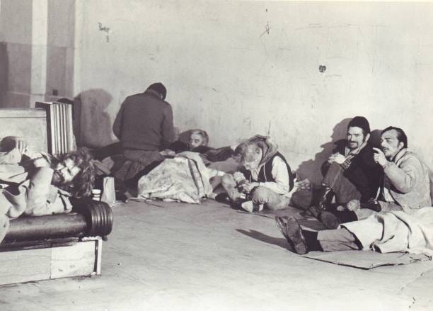 Homeless men sit in the lounge area at Grand Central Station in Manhattan on February 11, 1985.