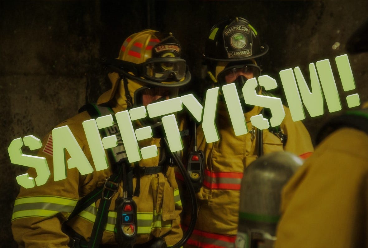 firefighters in full PPE with the word "SAFETYISM!" overlaid 