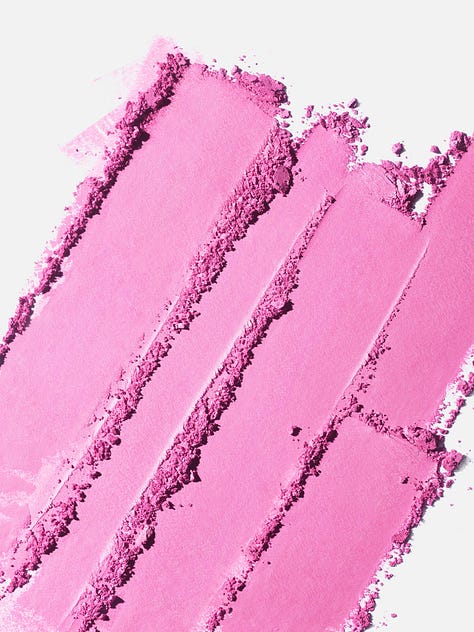 Three images: Six smears of blush; a makeup brush with bright pink blush on the end; and smears of hot pink blush.