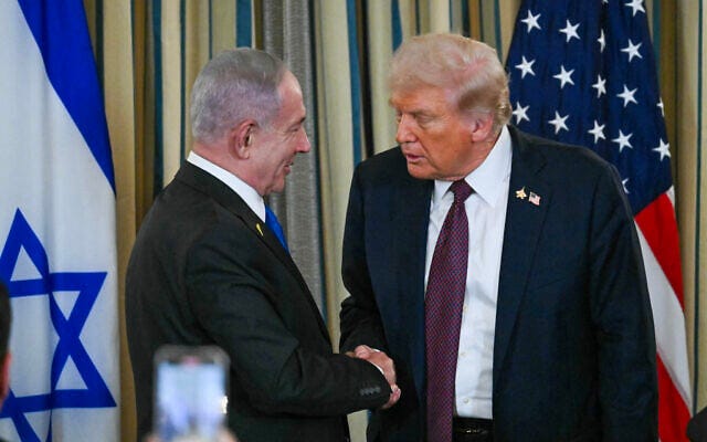 US President Donald Trump and Israeli Prime Minister Benjamin Netanyahu (L) shake hands at the end of a press conference at which Trump set out a plan to end the war in Gaza, in the State Dining Room of the White House in Washington, DC on September 29, 2025. (ANDREW CABALLERO-REYNOLDS / AFP)