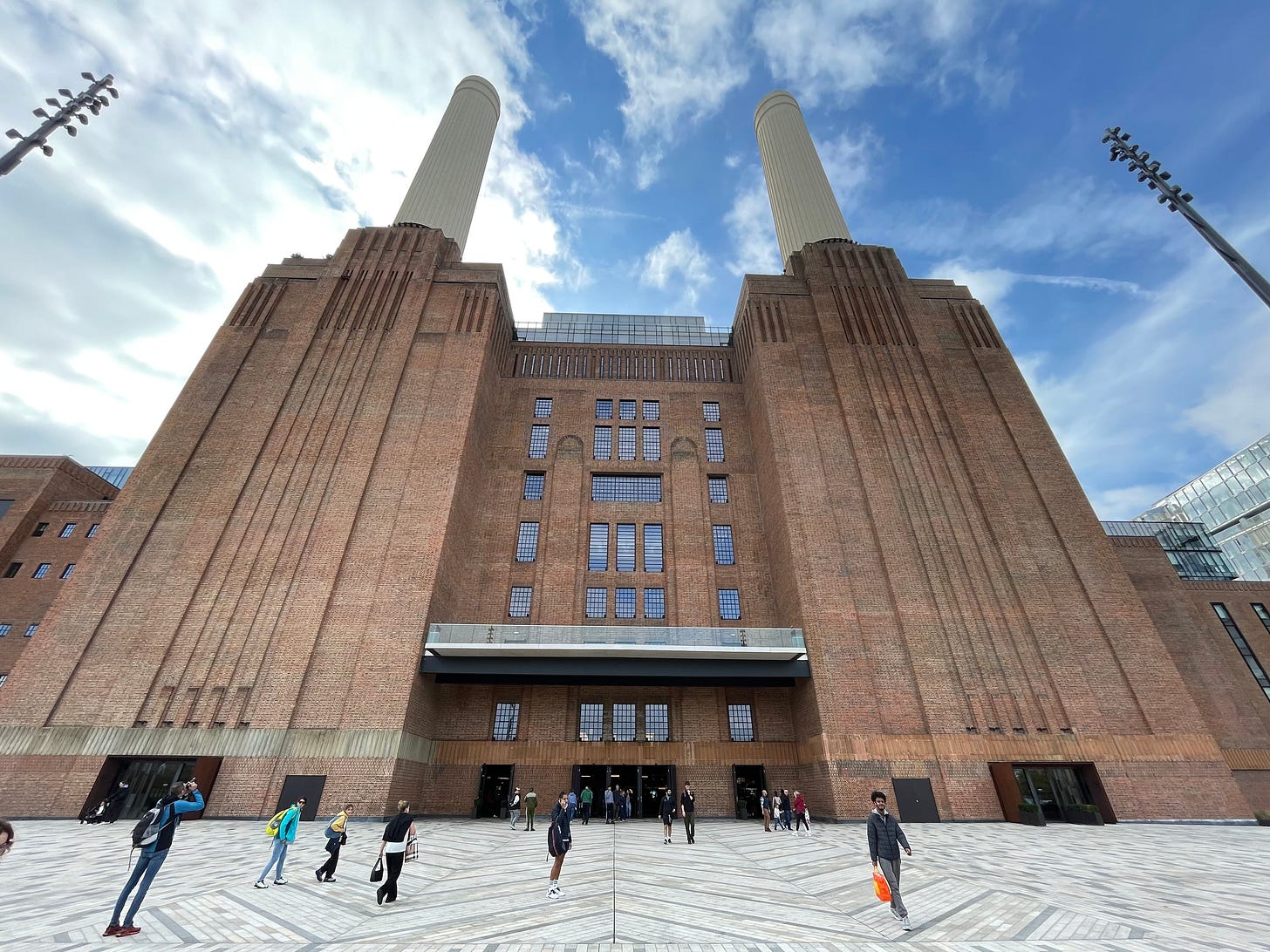 Battersea Power station - an immense brick built edifice with towering white chimneys.