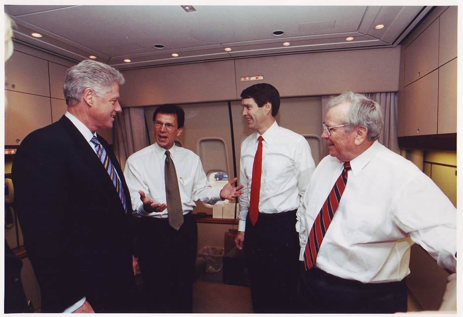 A group of men in suits talking

AI-generated content may be incorrect.