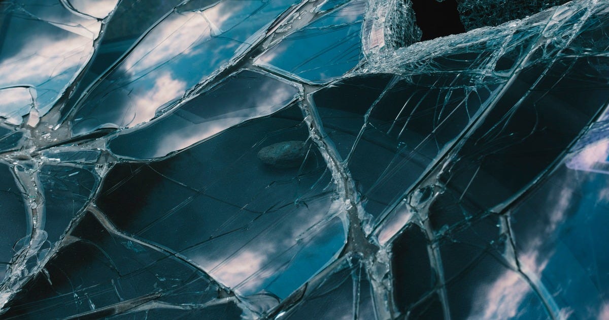 Image of warped, shattered, reflective surfaces.