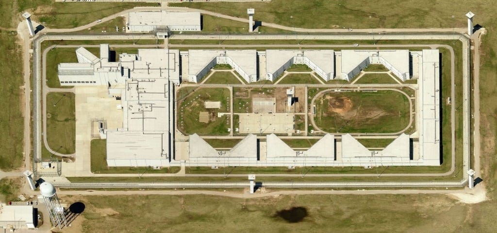 An aerial view of a prison complex An aerial view of a prison complex