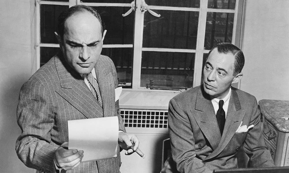Medium shot of men looking at a piece of paper

AI-generated content may be incorrect.