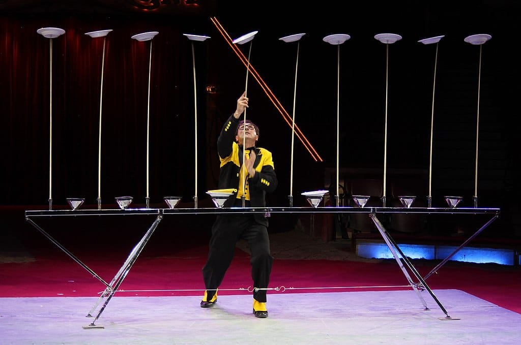 Juggler keeping lots of plates spinning Juggler keeping lots of plates spinning