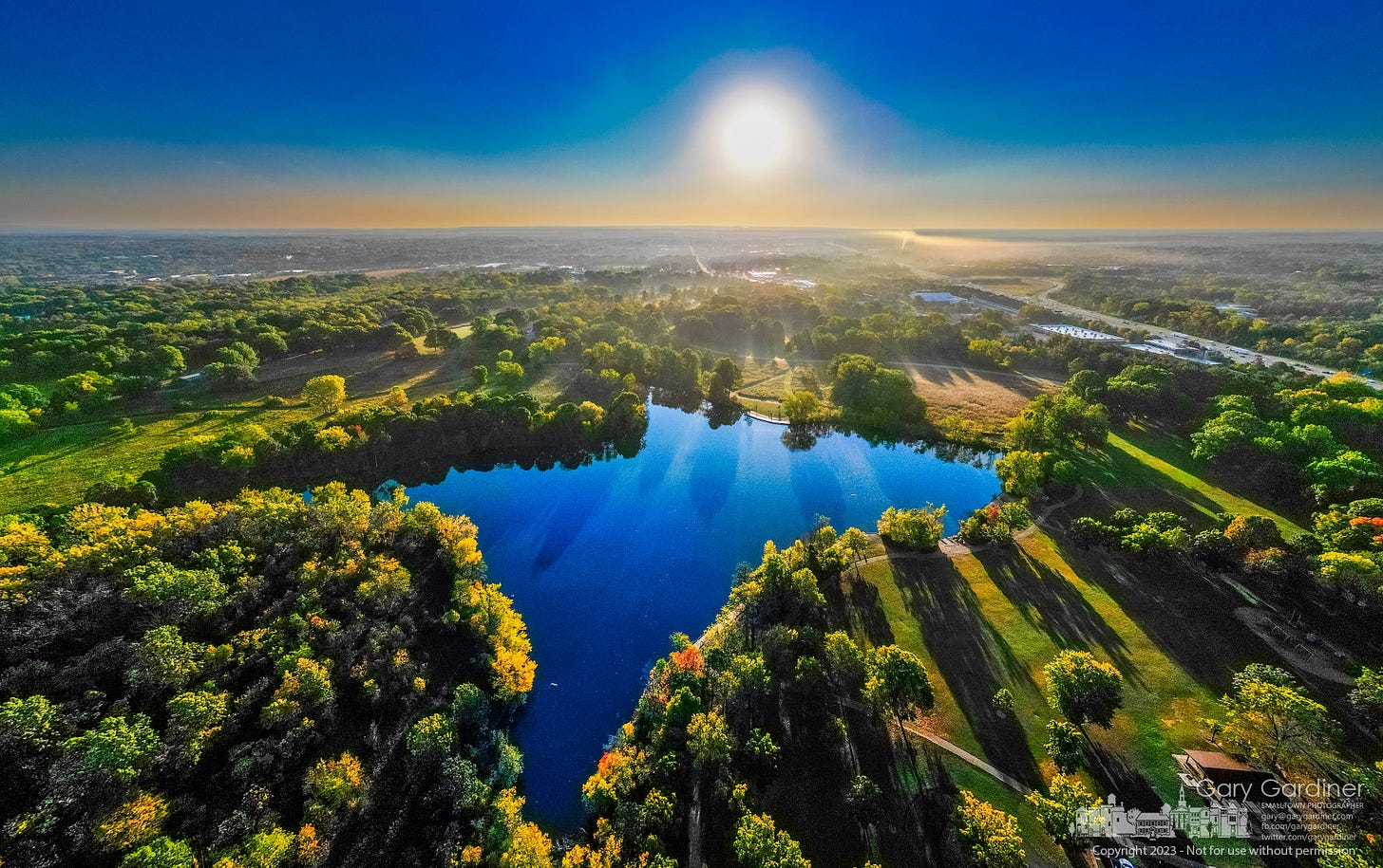 Shadows from the morning sun lay across Schrock Lake and Sharon Woods Metro Park as the fog begins to evaporate on what will be a hot fall day. My Final Photo for October 2, 2023. Shadows from the morning sun lay across Schrock Lake and Sharon Woods Metro Park as the fog begins to evaporate on what will be a hot fall day. My Final Photo for October 2, 2023.