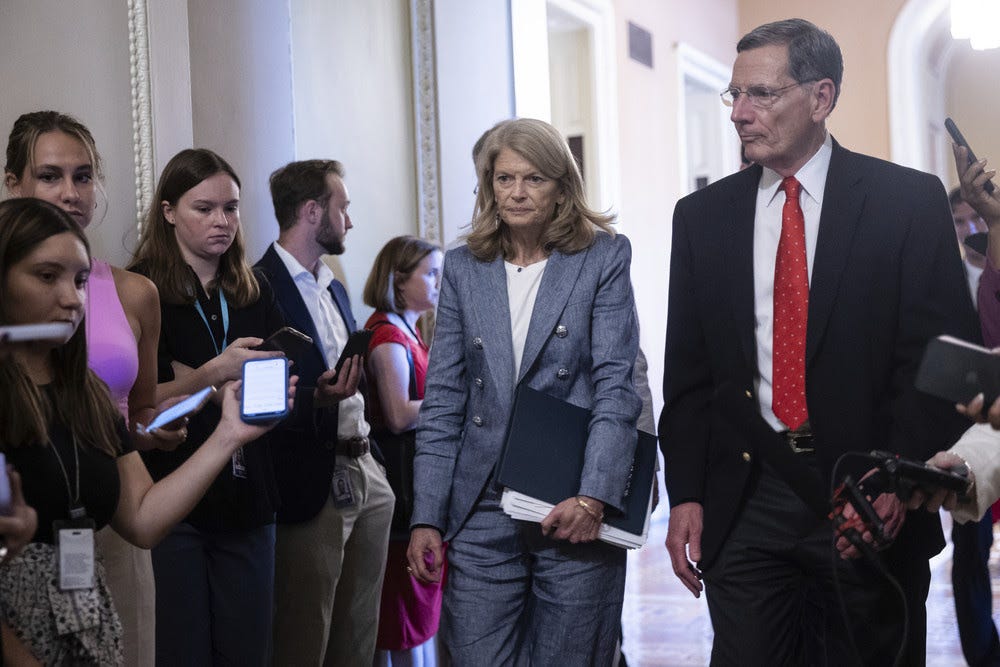 Sen. Lisa Murkowski (R-Alaska) walks with Senate Majority Whip John Barrasso (R-Wyo.) during a series of votes on a budget reconciliation bill for President Trump's legislative agenda at the U.S. Capitol June 30, 2025. (Francis Chung/POLITICO via AP Images)