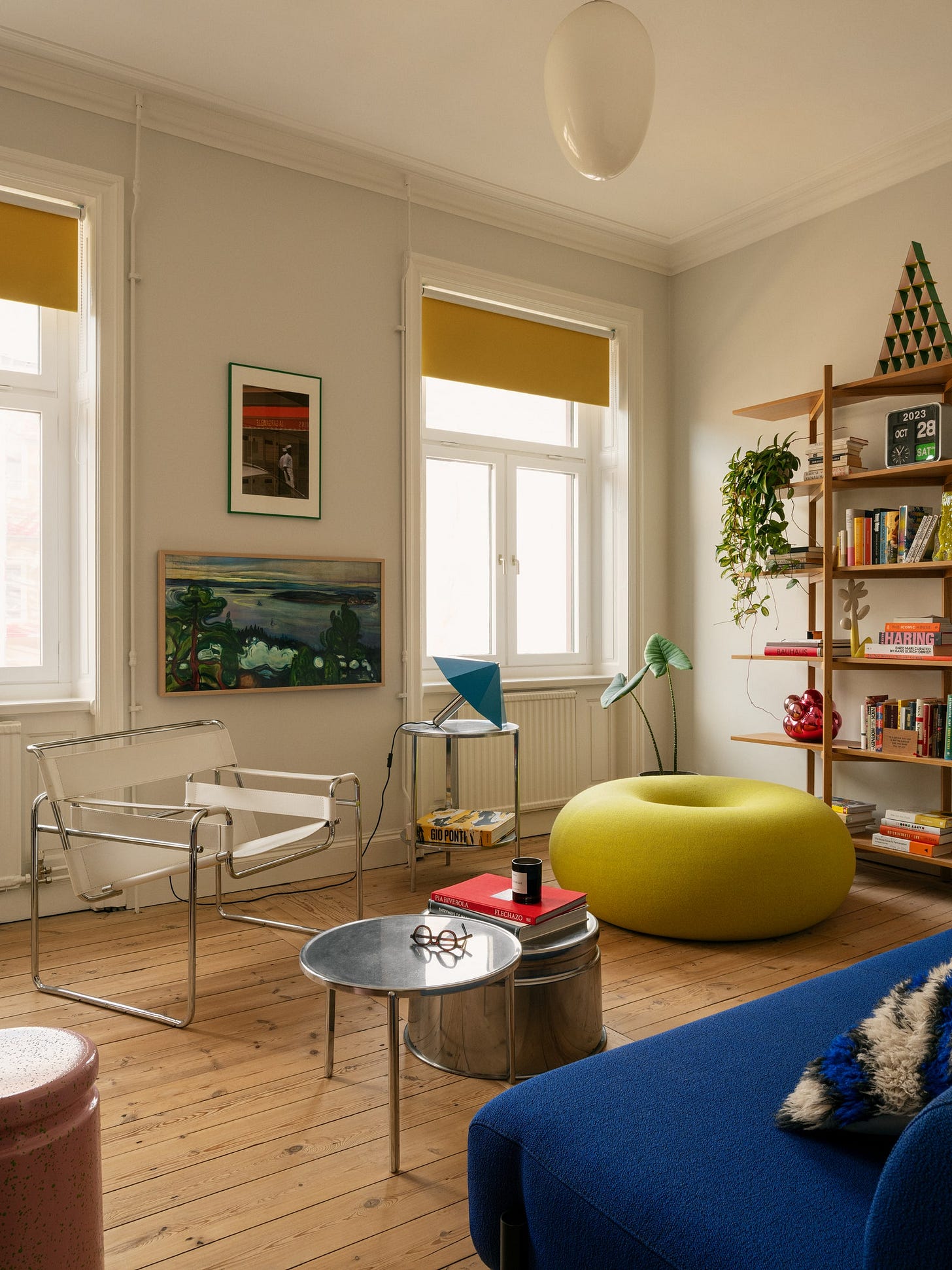 Image may contain Furniture Art Painting Architecture Building Indoors Living Room Room Chair Plant and Home Decor