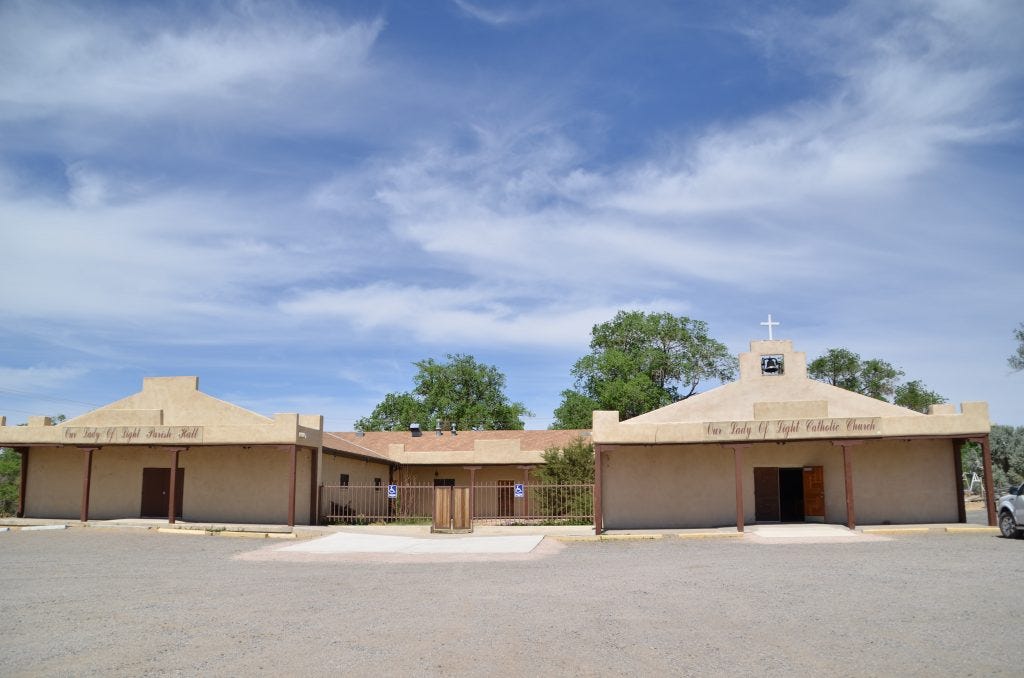 Our Lady of Light, right, and the parish hall, left