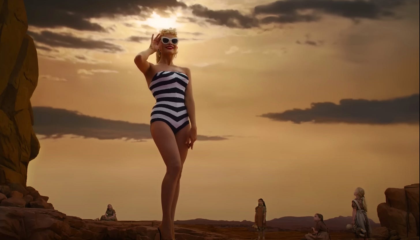 The opening of scene in Barbie which reenacts 2001: A Space Odessy. Little girls look up to a giant Barbie doll.