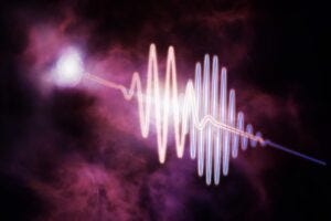 A major study from the Center for Astrophysics | Harvard & Smithsonian has found the Universe’s missing matter using Fast Radio Bursts—brief radio flashes from distant galaxies. This illustration shows one such burst traveling through the intergalactic medium, where longer wavelengths (red) slow down more than shorter ones (blue), helping astronomers detect otherwise invisible matter.