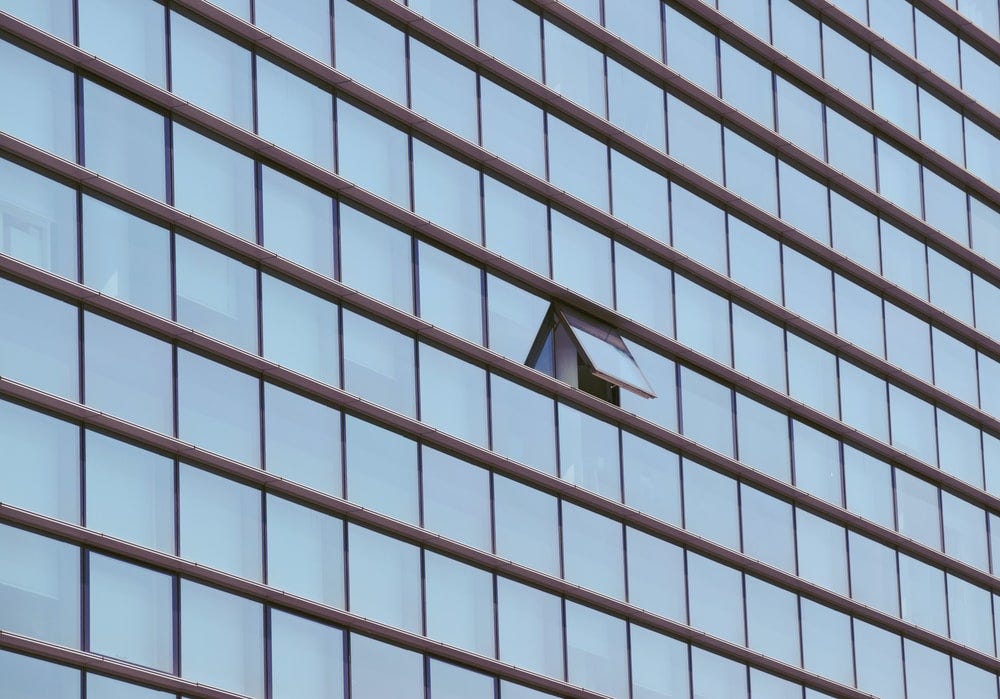 building with opened window building with opened window
