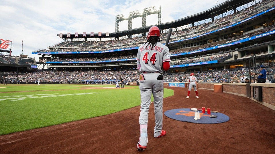 A photo of a baseball player on the field, with a crowd filling the seats A photo of a baseball player on the field, with a crowd filling the seats