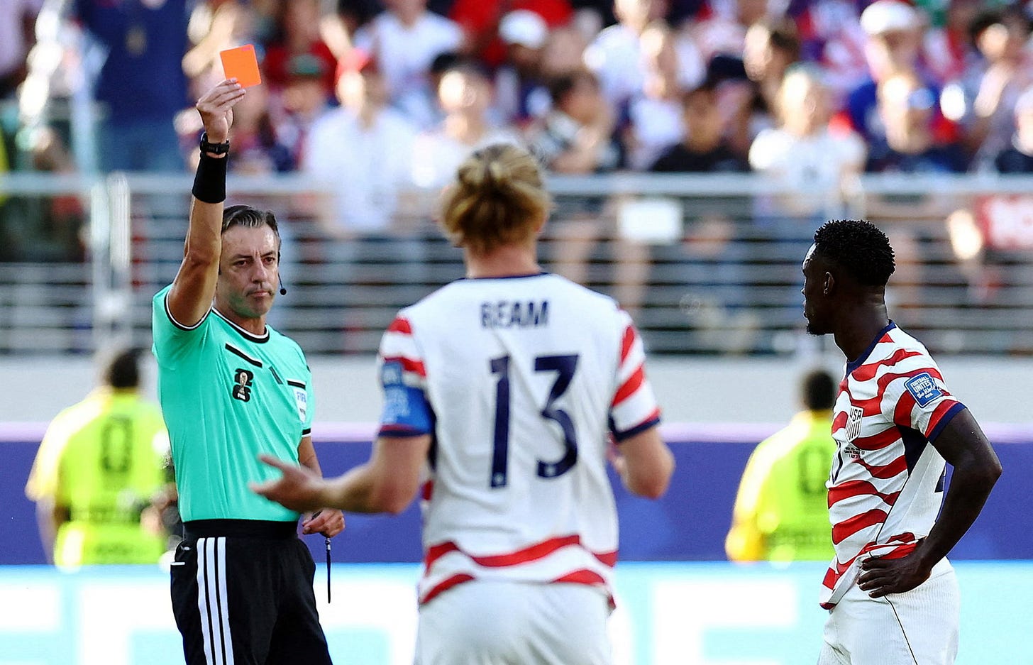 The USA’s Folarin Balogun is shown a red card by the referee Raphael Claus. The USA’s Folarin Balogun is shown a red card by the referee Raphael Claus.