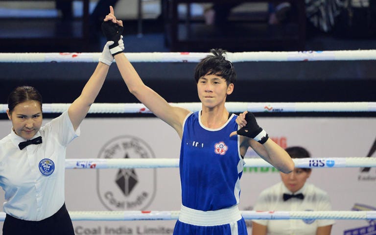 Taiwan's Lin Yu-Ting, who has previously failed a gender test, fights Sitora Turdibekova from Uzbekistan on Friday - SAJJAD HUSSAIN/AFP