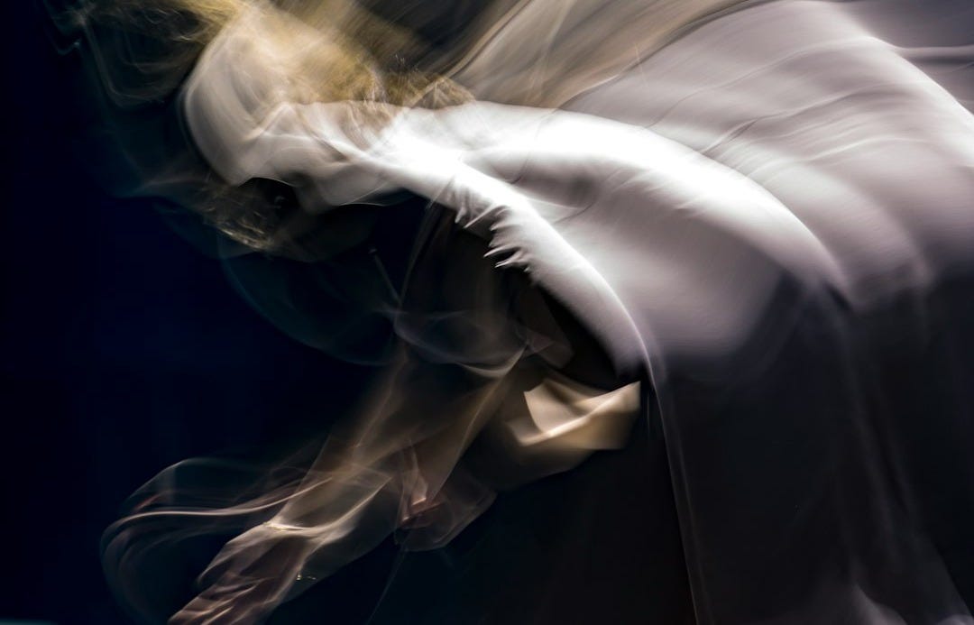 a blurry photo of a person doing a trick