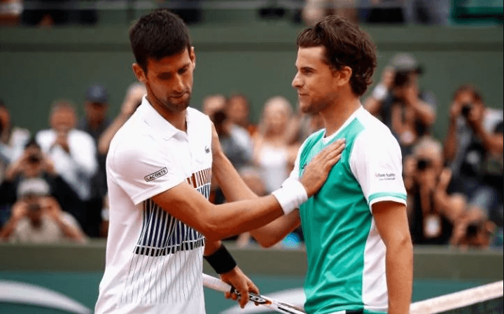 novak djokovic strokes dominic thiem chest at french open loss novak djokovic strokes dominic thiem chest at french open loss