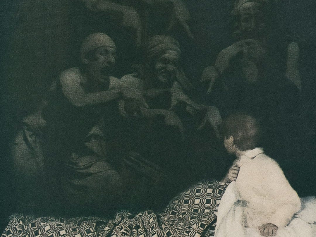 A woman sitting on a bed next to a statue A woman sitting on a bed next to a statue