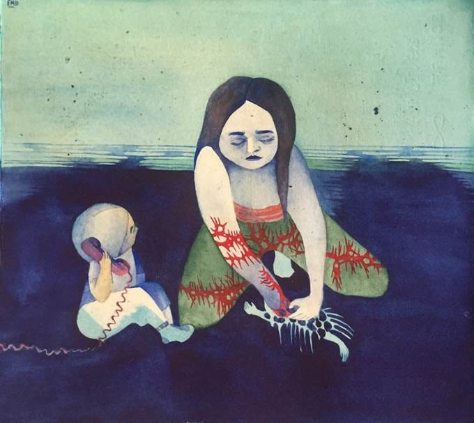 A woman and a child on a beach. The child holds a telephone and the woman holds a bone-like object.