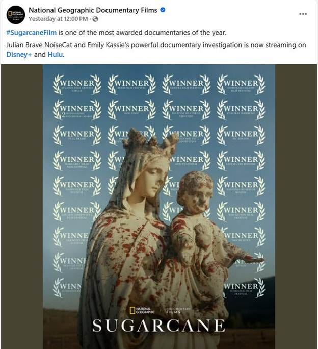 A statue of a person holding a child

AI-generated content may be incorrect.