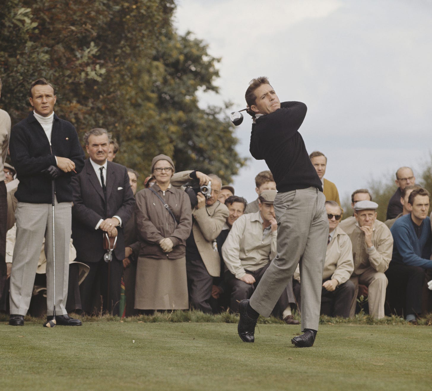 Gary Player driving with Arnold Palmer watching Gary Player driving with Arnold Palmer watching