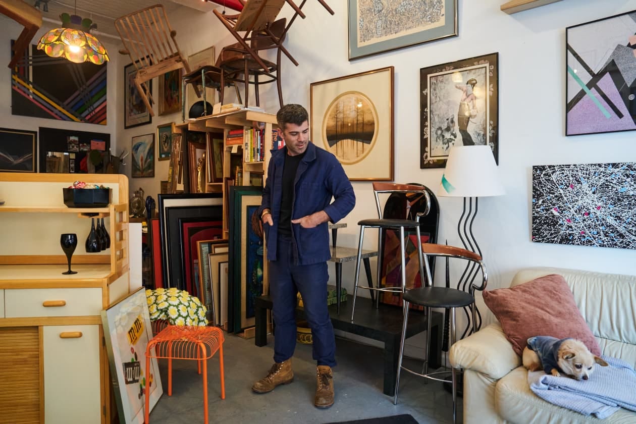 Harding and his rescue Chihuahua, Peanut, at Sidepiece, a furniture showroom he co-owns in the Bushwick neighborhood of Brooklyn.