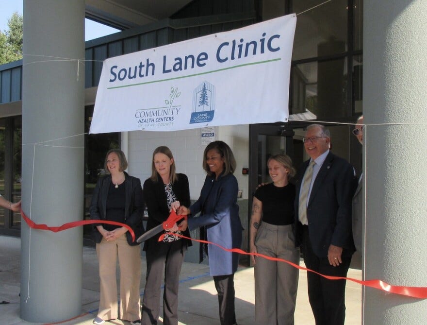 The ribbon cutting for the South Lane Clinic took place on Aug. 28, 2025. Speakers at the event included Lane County commissioner Heather Buch (left), Health and Human Services director Eve Gray, Lane Community College president Stephanie Bulger, Val Hoyle healthcare aid Caitlyn McCabe, and "Be Your Best" co-founder Jim Gilroy.