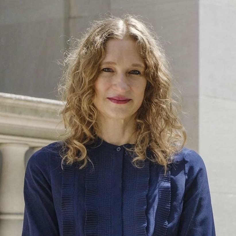 Claire Gilman, Acquavella Curator and Department Head of Modern and Contemporary Drawings at the Morgan Library & Museum, wearing a dark blue blouse outdoors.