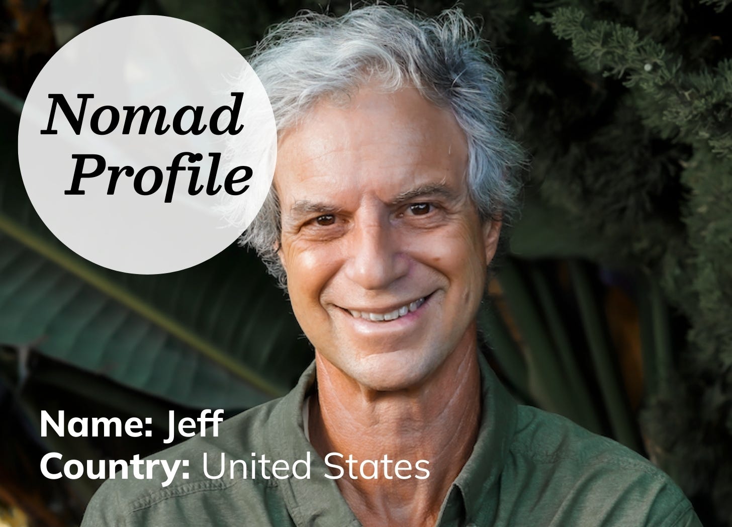 Older white man with grey hair is wearing a light green shirt and smiling at the camera.