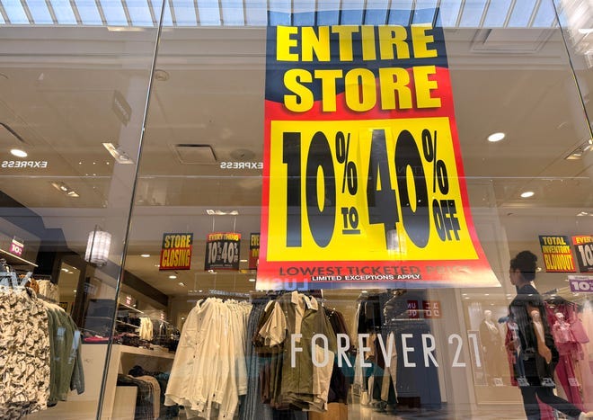 A sign advertising a storewide sale is displayed in a window at a Forever 21 store that is preparing to close on February 20, 2025 in San Francisco, California. Clothing retailer Forever 21 is set to close 200 stores as the company searches for a buyer and considers a second bankruptcy filing. Forever 21 could have to liquidate its entire chain of nearly 350 stores if no buyer emerges.