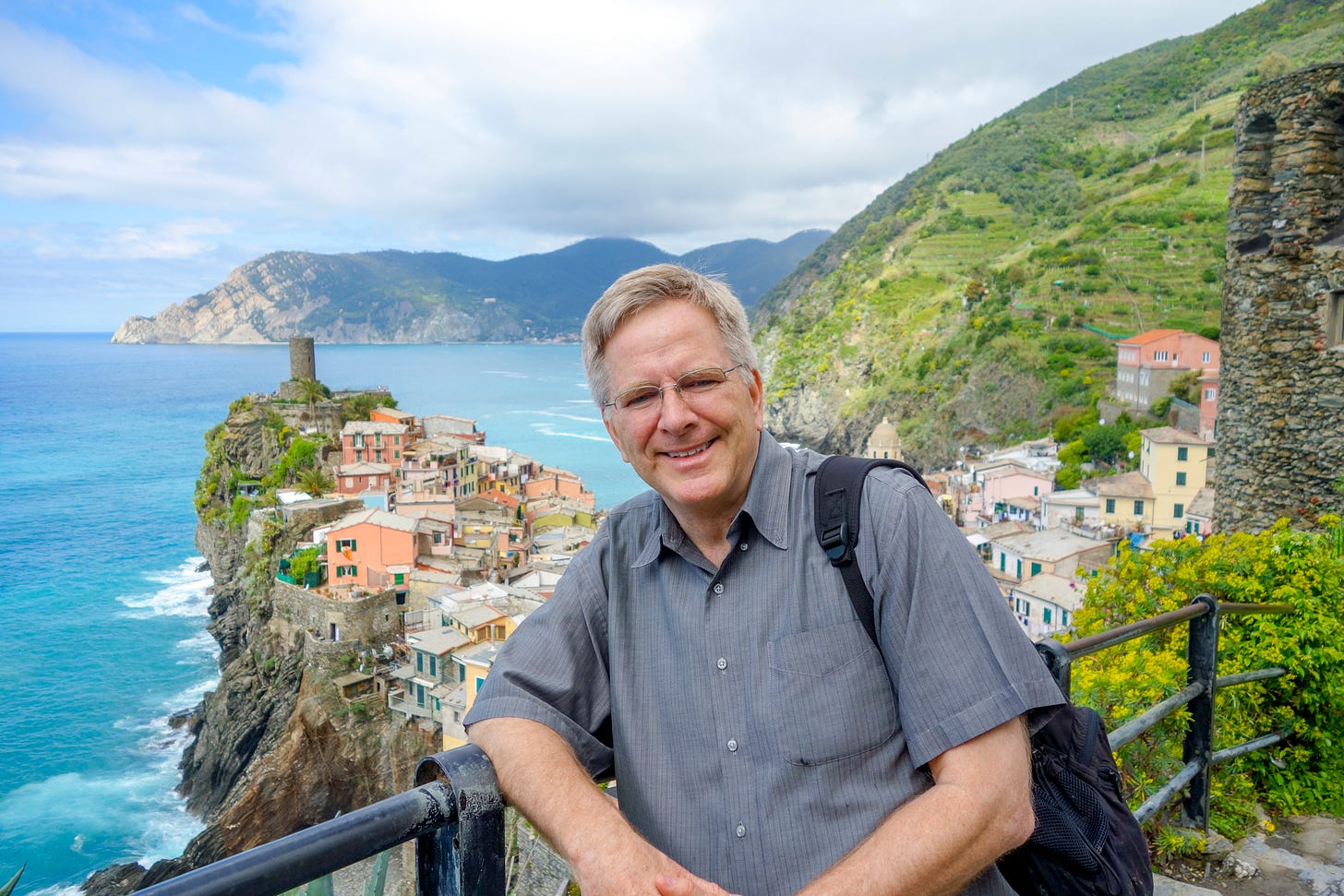 Travel guru Rick Steves posed with Italy's Cinque Terre in the background Travel guru Rick Steves posed with Italy's Cinque Terre in the background