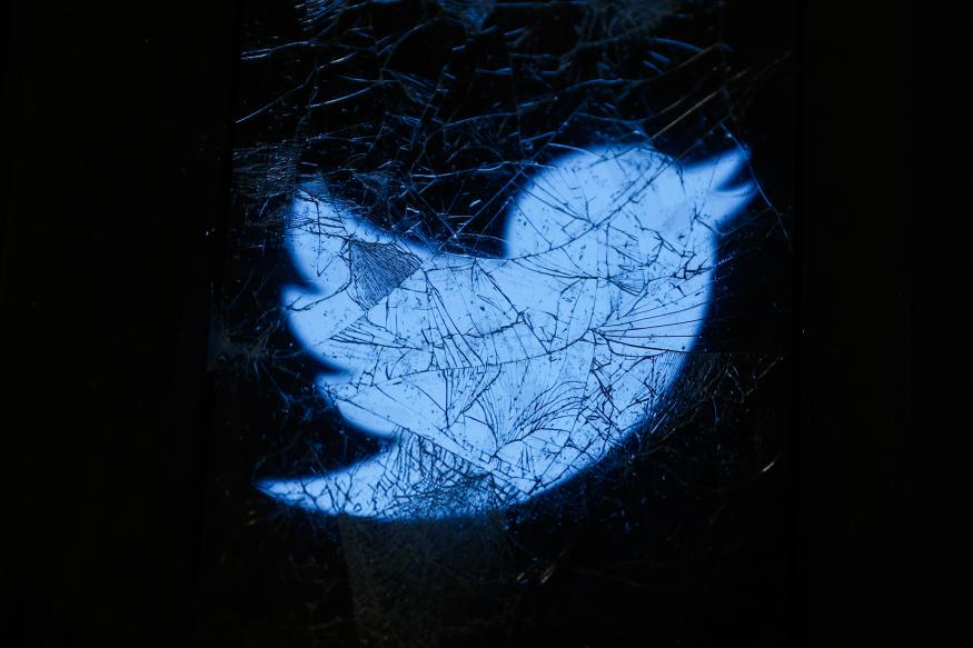 Twitter logo displayed on a phone screen is seen through the broken glass in this illustration photo taken in Krakow, Poland on November 5, 2022. (Photo by Jakub Porzycki/NurPhoto via Getty Images)