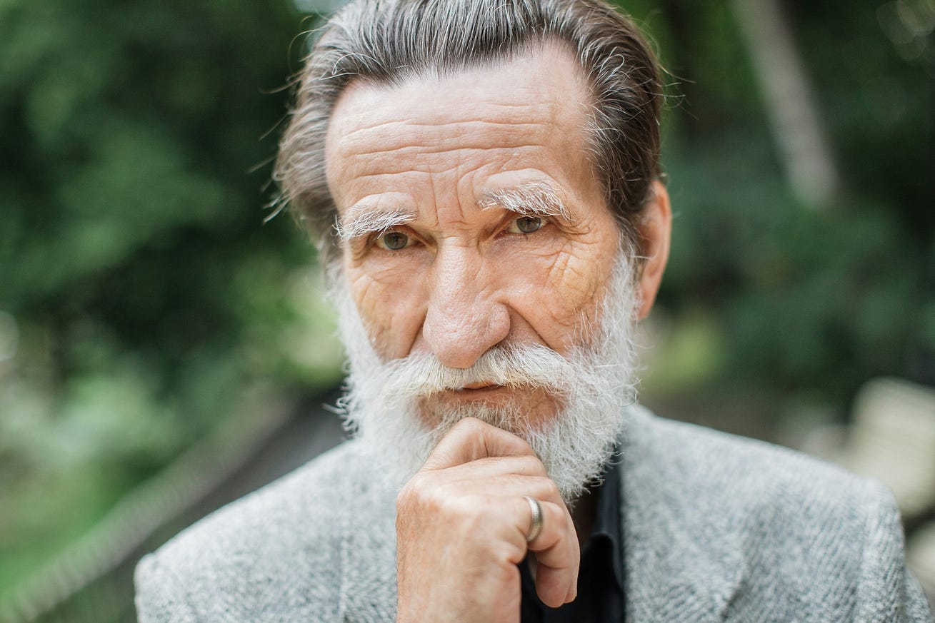 handsome-aged-man-in-stylish-clothes-relaxing-at-green-park-caucasian-pensioner-with-grey-beard-posing-during-sunny-day-outdoors — With permission Getty Images on Unsplash+ handsome-aged-man-in-stylish-clothes-relaxing-at-green-park-caucasian-pensioner-with-grey-beard-posing-during-sunny-day-outdoors — With permission Getty Images on Unsplash+