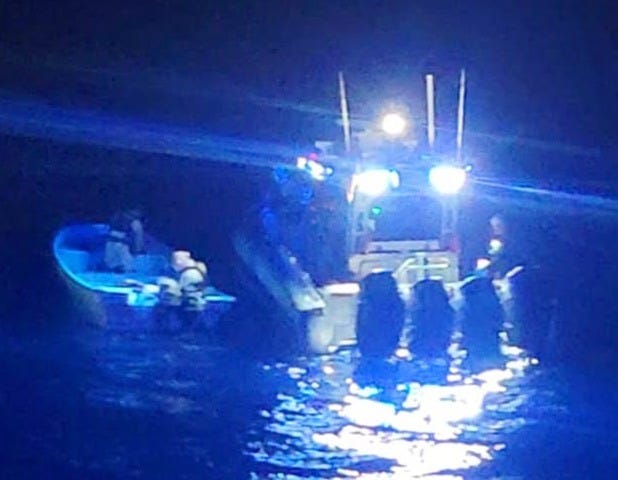 US Customs & Border Protection patrol boat stops a suspected smuggling boat at sea 