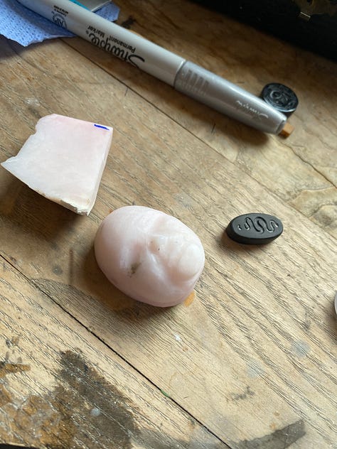 man carved out of pink opal