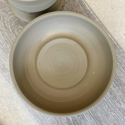 unfired clay bowl, glazed and finished bowl, bowl with food in it