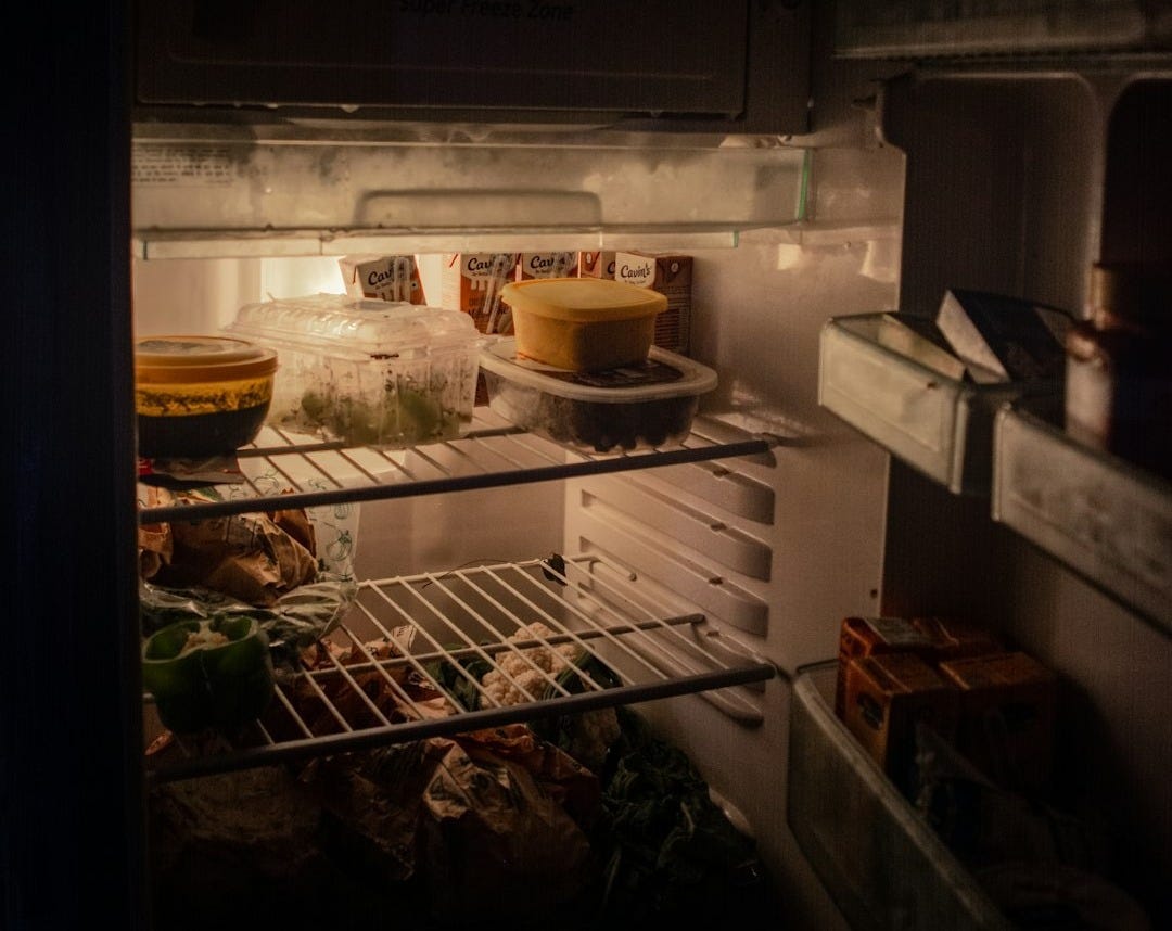 white refrigerator with food inside