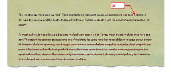 A tear sheet showing edited text, with some lines scratched out in red. 