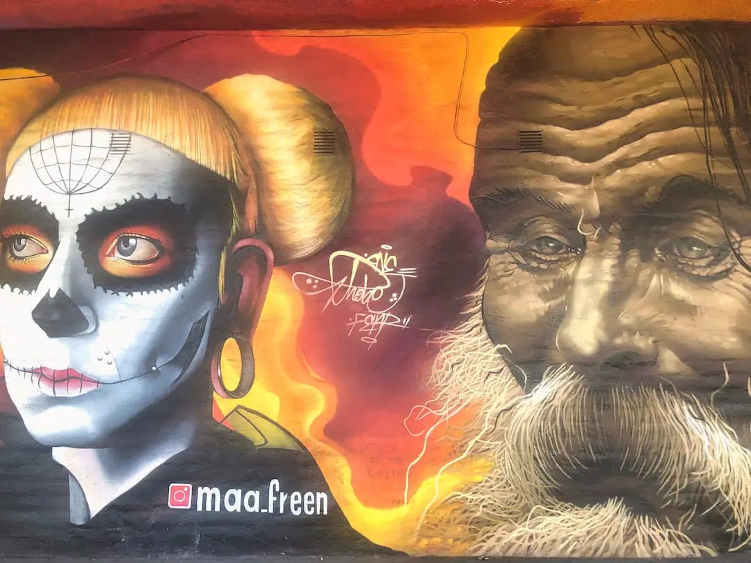 Street art in Guadalajara - a woman with white face paint and a man with moustache and beard