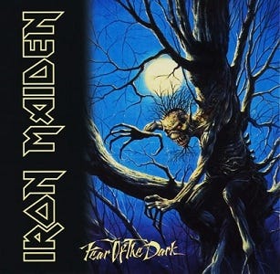 Cover art for Fear of the Dark by Iron Maiden. It shows a fearsome monster sitting on a tree with no leaves on moonlit night. Cover art for Fear of the Dark by Iron Maiden. It shows a fearsome monster sitting on a tree with no leaves on moonlit night.
