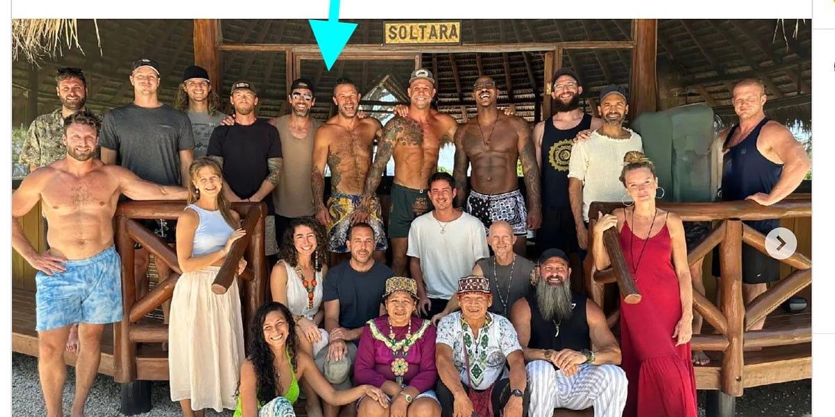 A group of people posing for a photo

Description automatically generated