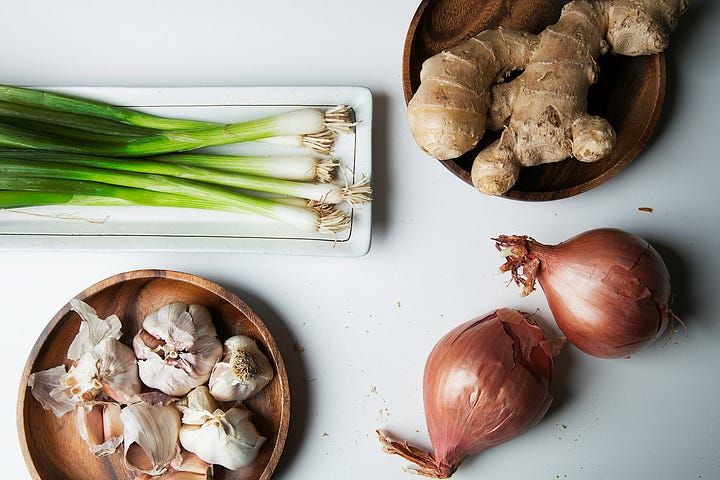 Chilies, veggies and herbs. Garlic, shallots, green onions and ginger. Photos by Amoon Ra and Nanxi Wei via Unsplash.