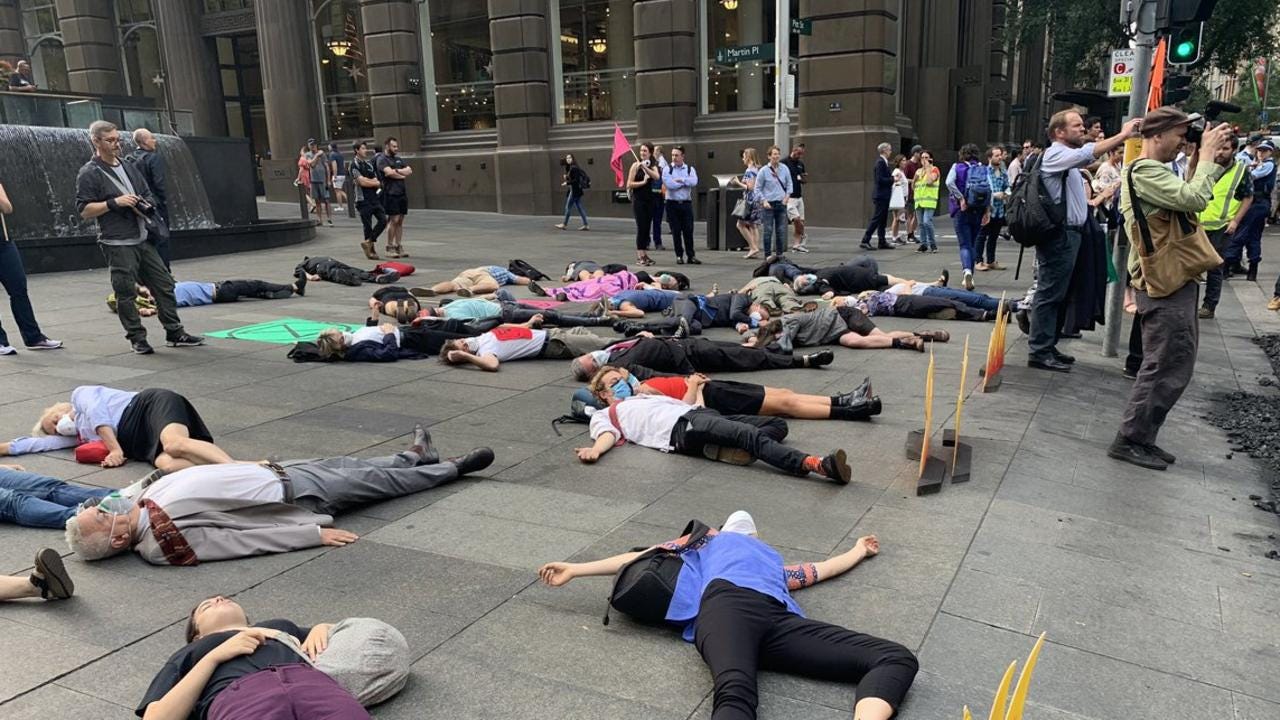 Extinction Rebellion dump coal and glue 'reindeers' in CBD protest ...
