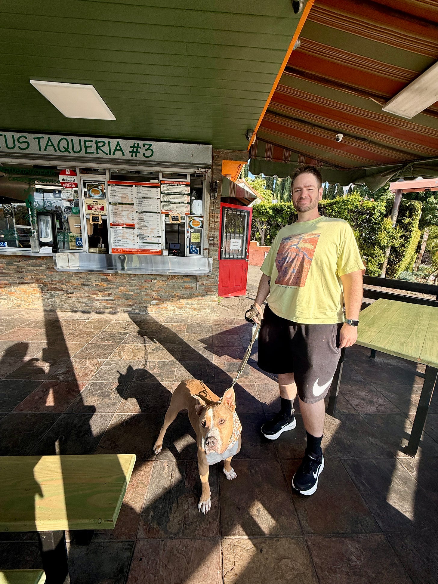 Elvis and Rob at an outdoor taco shop