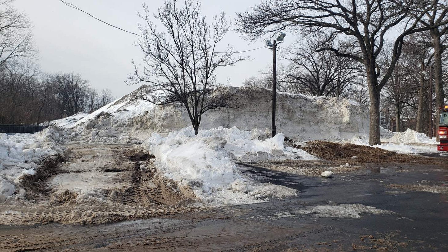 May be an image of snowplow, ski slope and road