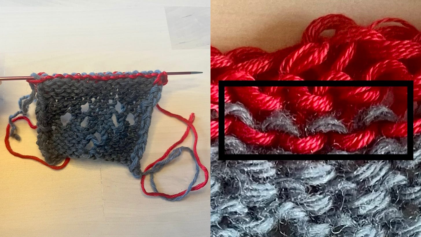 A hand using a thin needle to pick up stitches along the edge of a knitted swatch, with red waste yarn visible above.  A close-up of the knitted fabric showing where the red waste yarn meets the grey main yarn, with a black rectangle highlighting the row of loops to be picked up