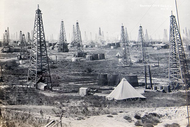 Historical photo of oil derricks in the town of Ranger Historical photo of oil derricks in the town of Ranger