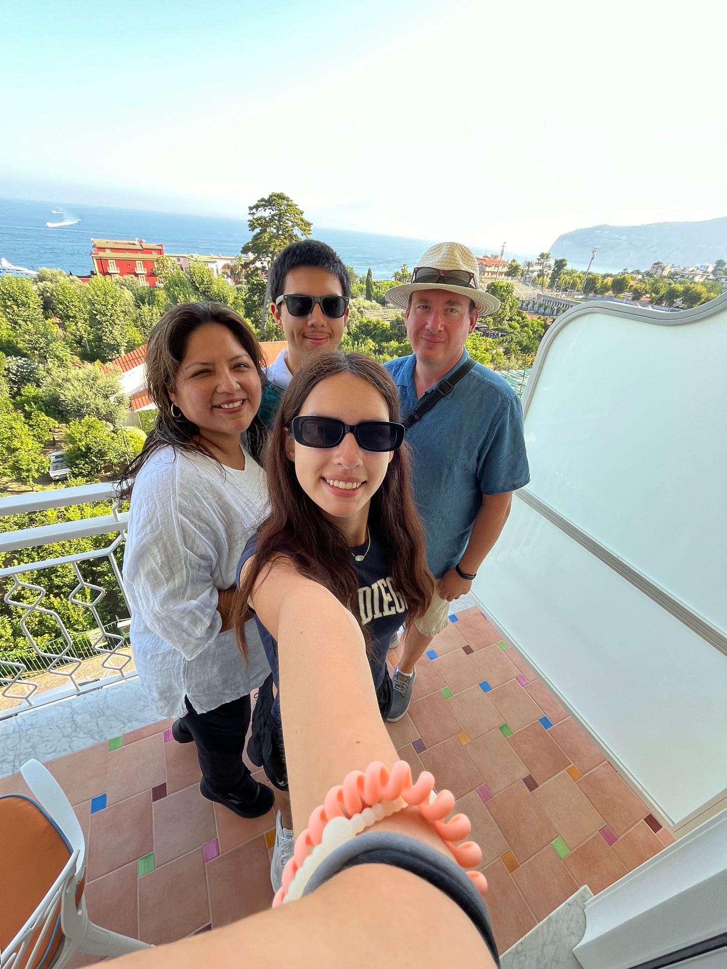 Matthew Long standing outdoors with his wife, Jannett, and their two children on a sunny day during a family vacation in Italy. Matthew Long standing outdoors with his wife, Jannett, and their two children on a sunny day during a family vacation in Italy.